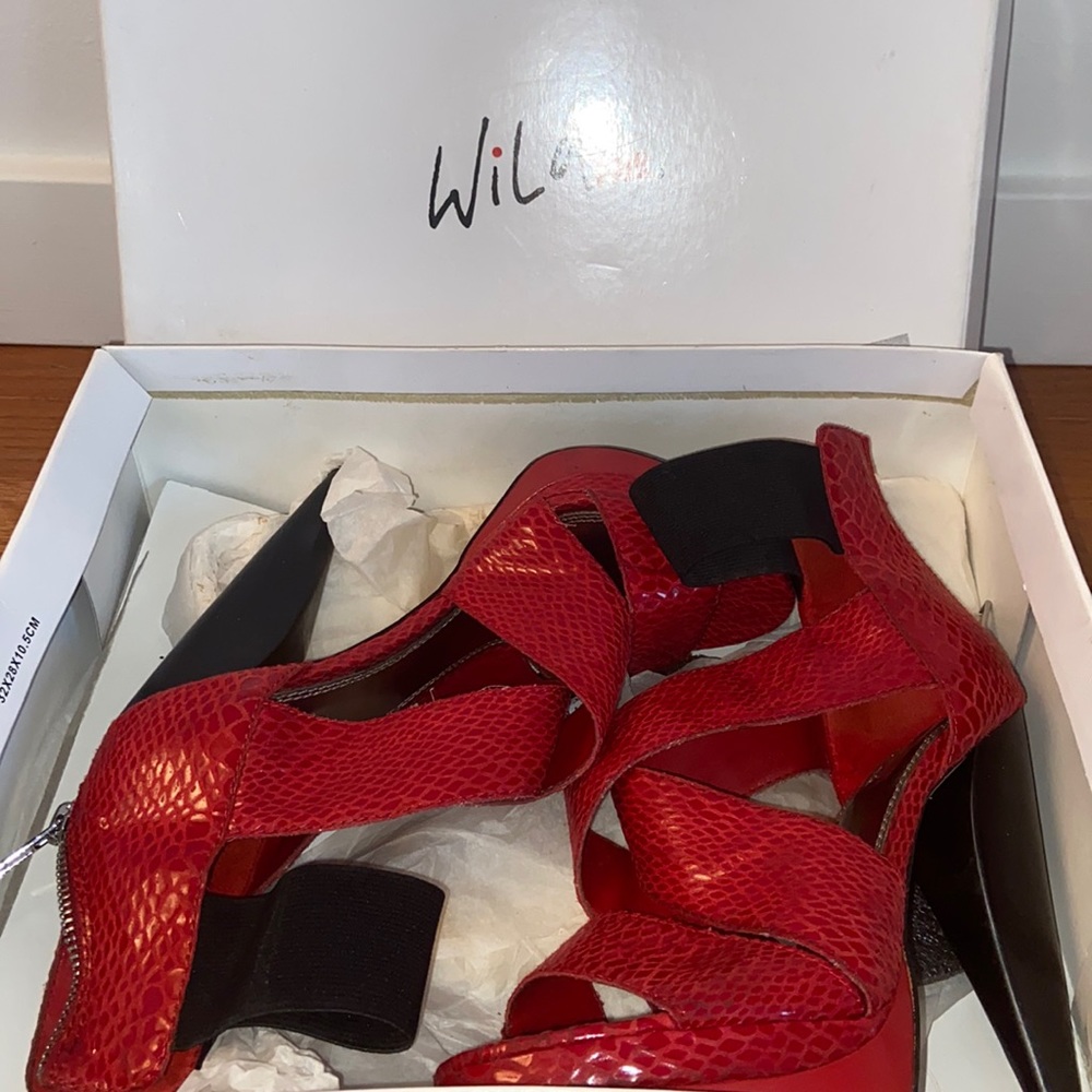 SOLD!!! 
GENTLY USED WILD BLACK/RED HEELS SIZE 7